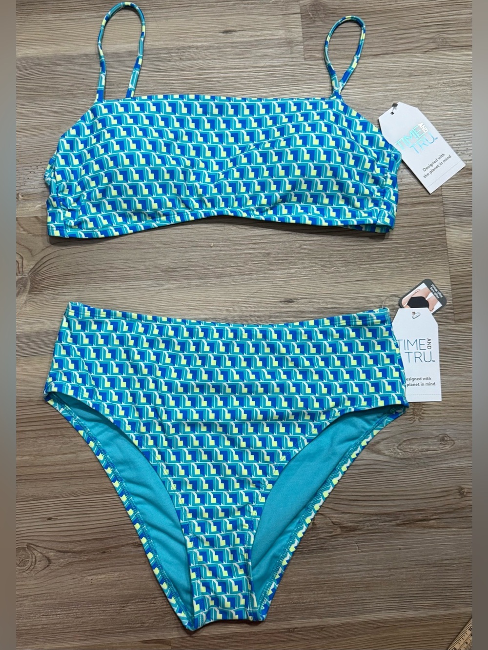 Time and Tru high-waist bikini bottoms feature a blue and teal geometric